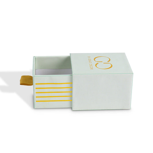 Side view of custom mint green drawer box pulled open with golden ribbon tab and stripes