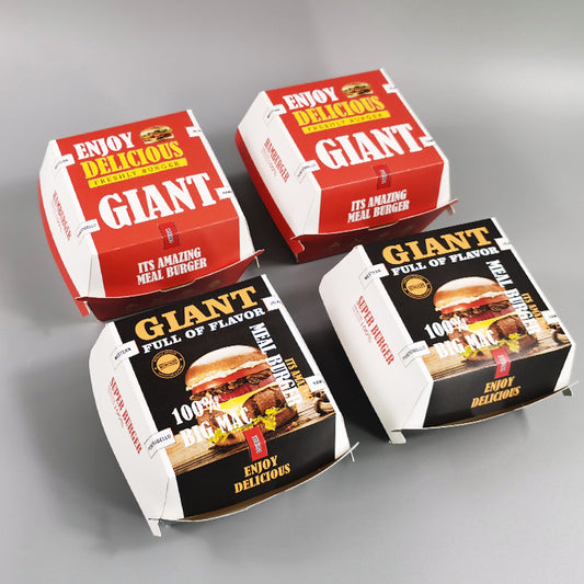 Stacked printed burger boxes with 'Enjoy delicious' and 'GIANT' designs