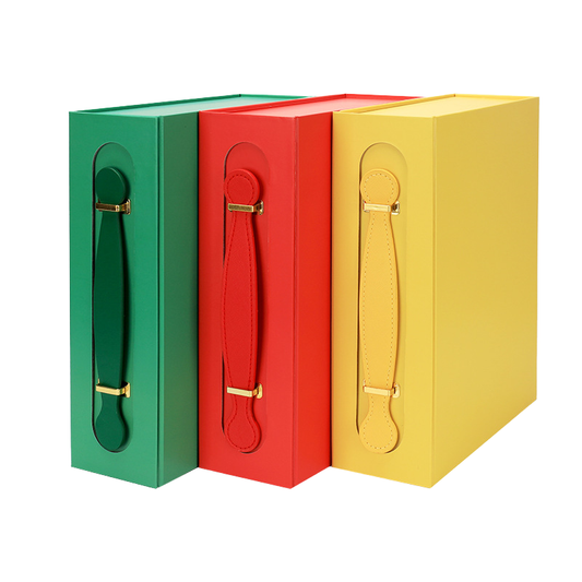 Set of rigid gift boxes with leather handles and gold-tone hardware