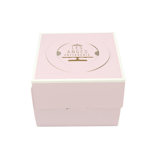 Pink rectangular cake box with gold logo on lid and vented-style top