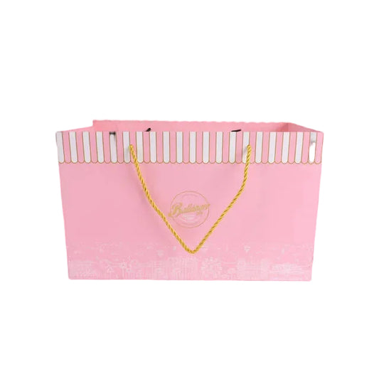 Pink rigid carrier bag with striped top and yellow rope handles.