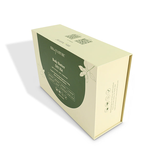 Light green rigid gift box with side panel text and leaf graphics, magnetic flap style.