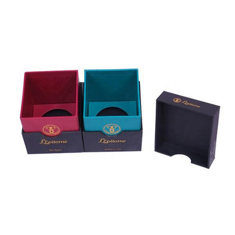 Color block watch packaging boxes in burgundy and teal with inner foam tray