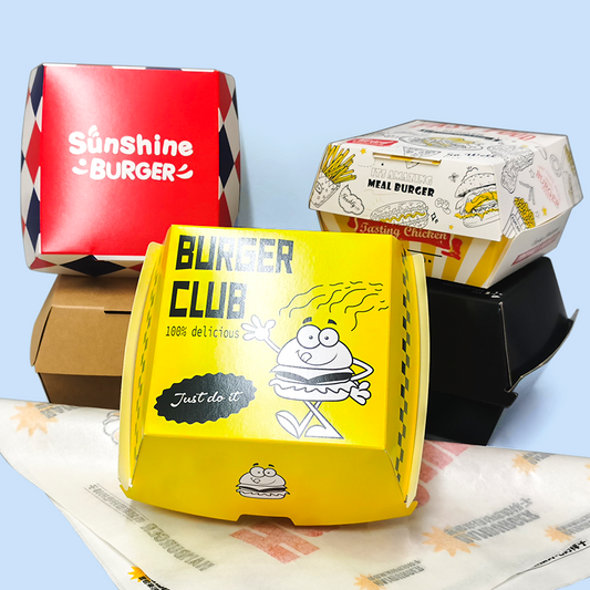 Fast food takeout packaging set with red, yellow, and white burger boxes and fries carton