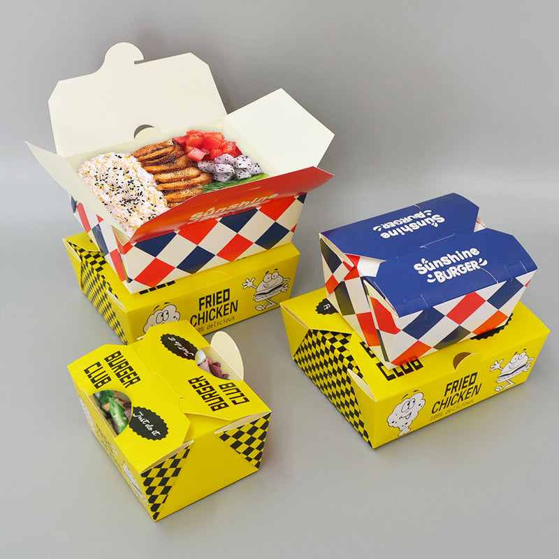 Set of printed clamshell chicken and burger boxes with opened lids and food inside