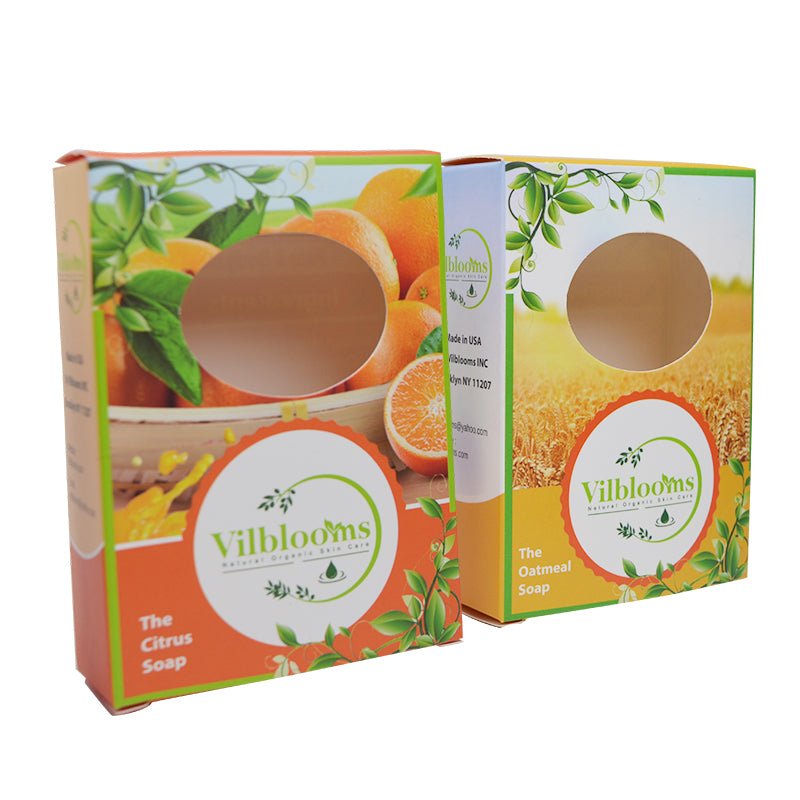 Pair of citrus soap cartons with clear round window openings, one open