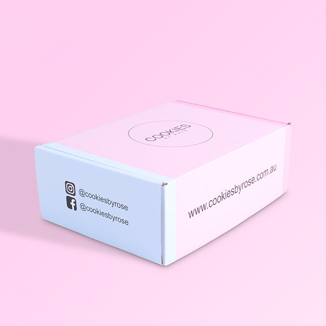 Corner view of pink and blue mailer box highlighting Facebook and Instagram social media icons