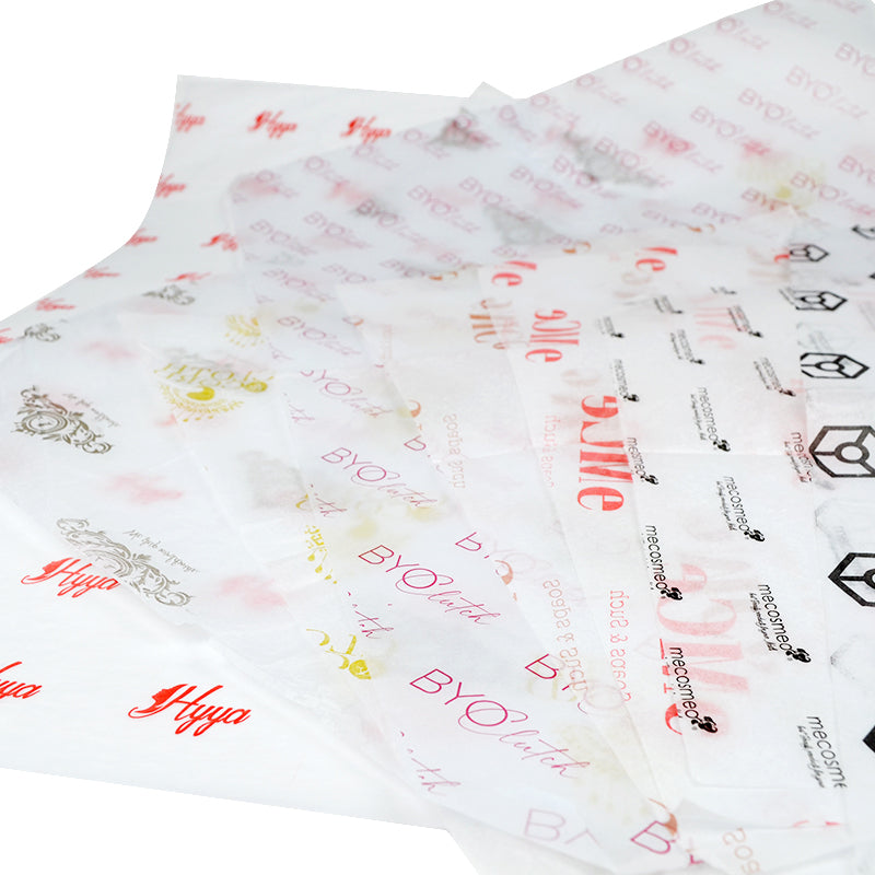 Crumpled texture of assorted custom tissue papers with various brand logos
