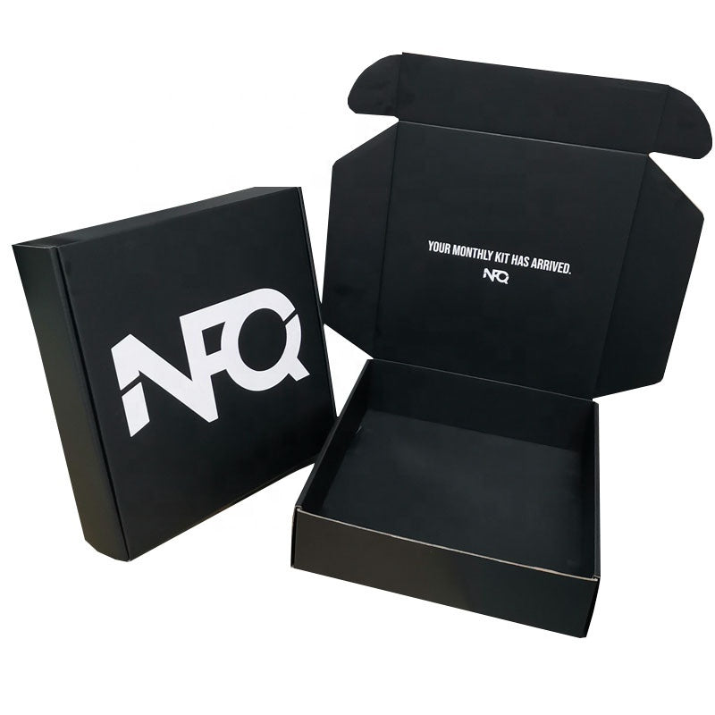 Black NQ themed mailer gift box set, open base with bold NQ front panel
