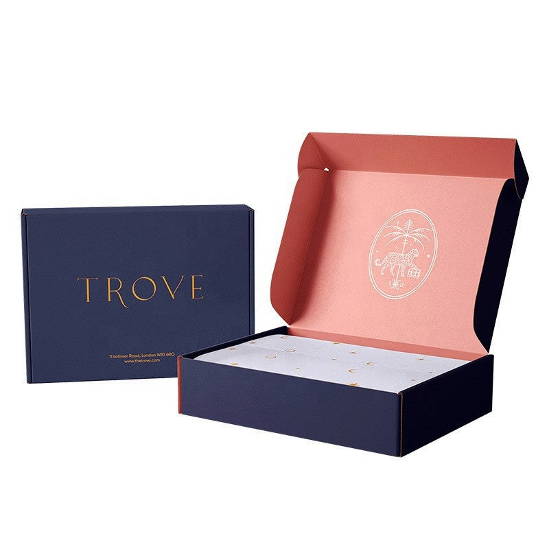 Trove branded mailer gift box set, navy outer box with gold lettering, open red insert