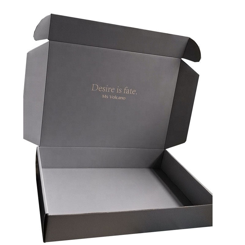 Gray mailer gift box set, open with subtle centered quote text on lid