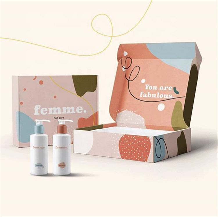 Femme themed beauty gift box set, open mailer with bottles and pink panel text