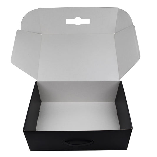 Open black corrugated mailer box with handle hole, showing interior.