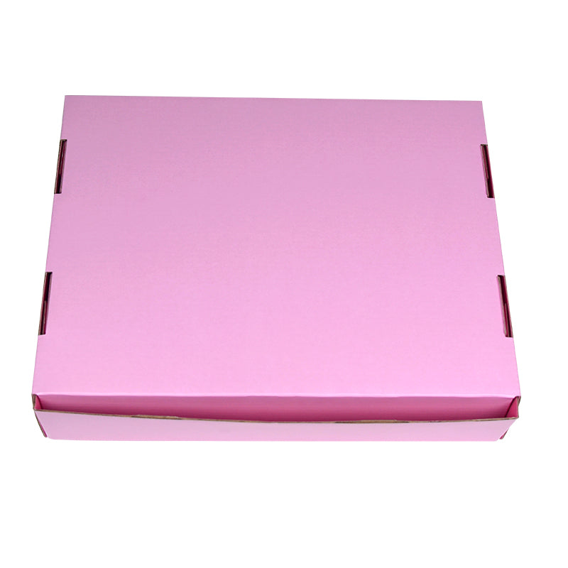 Closed pink corrugated mailer box showing die-cut slot closure structure