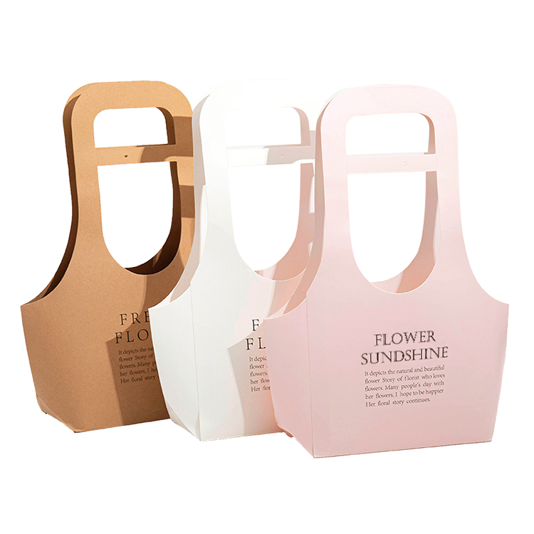 Assorted colors of kraft flower bouquet bags in brown, white, and pink with custom logo