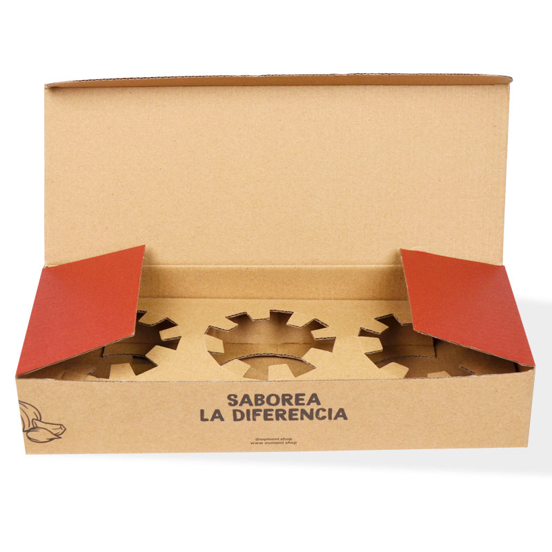 Open kraft food box with three gear-shaped insert cavities and "Saborea la Diferencia" print