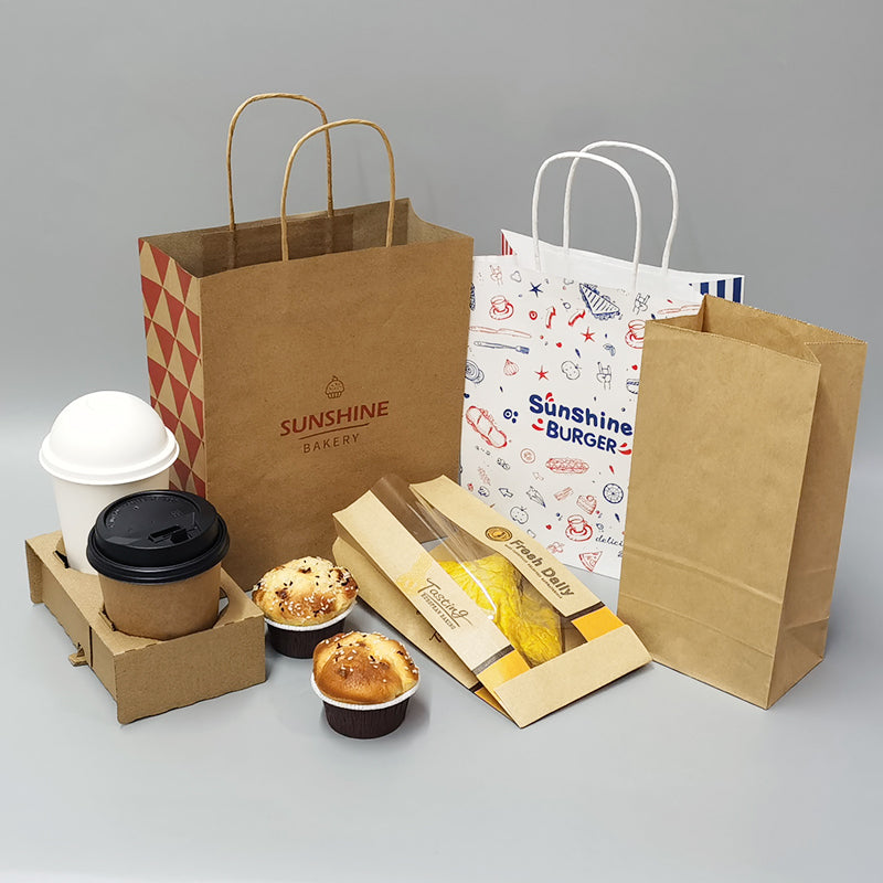 Bakery packaging set with custom kraft paper bags, cup carrier, pastry box, and coffee cups