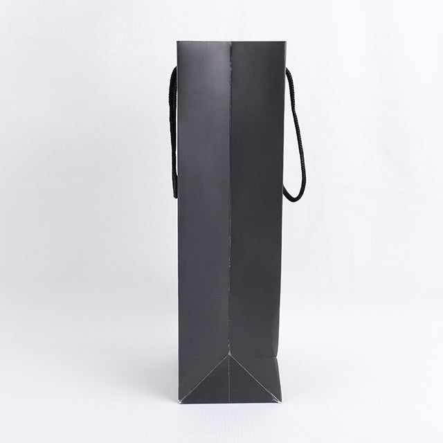 Black paper wine gift bag side view with loop rope handles