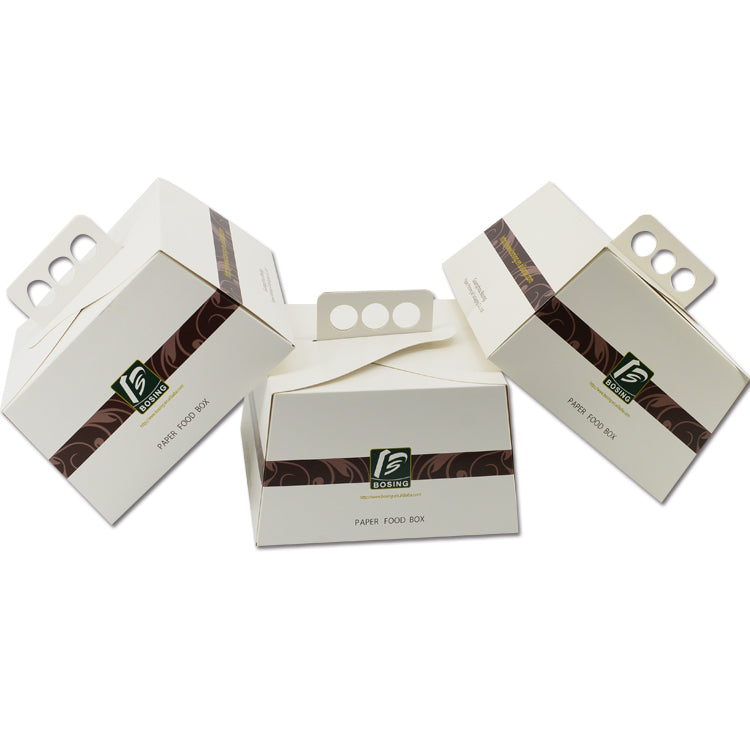 Multiple octagonal dessert boxes with handles and detachable wrapper bands