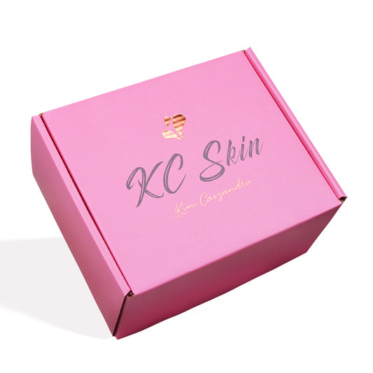 Closed custom pink folding mailer box with rose gold KC Skin logo for cosmetics shipping