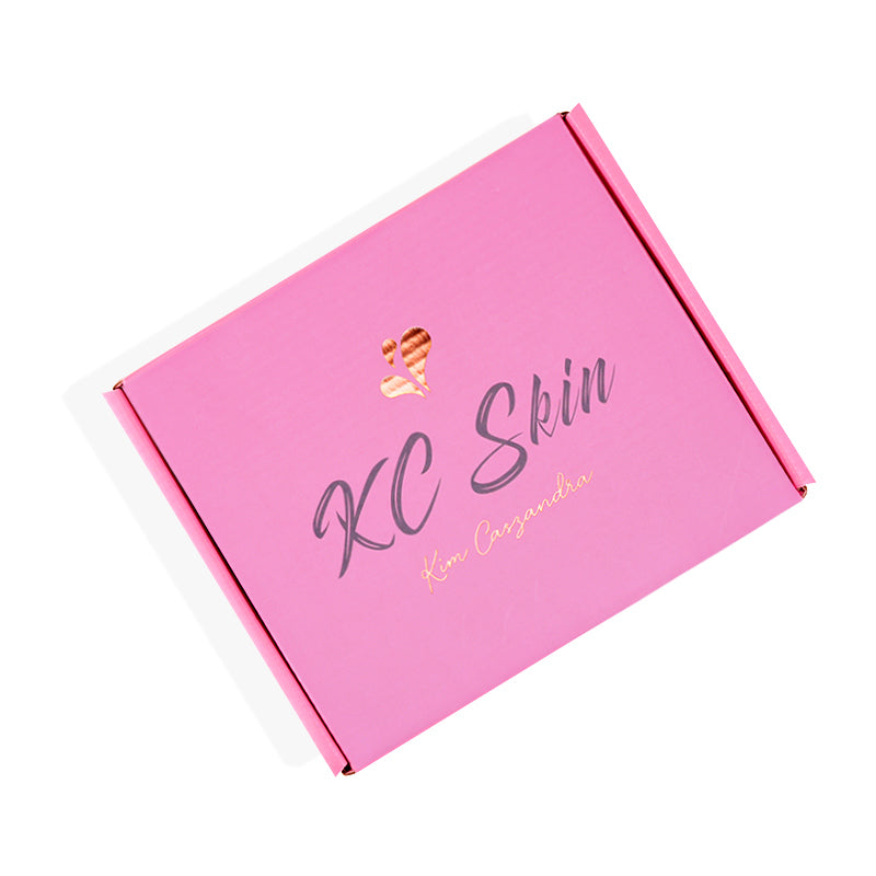 Front view of pink cardboard mailer box with butterfly accent and magnetic closure