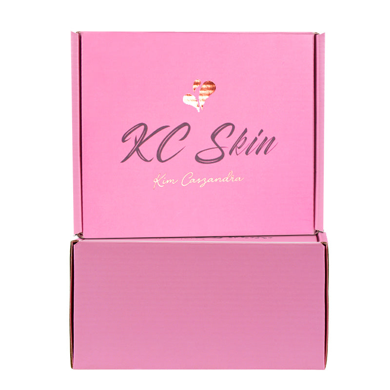 Closed and open pink branded mailer boxes for skincare e-commerce packaging