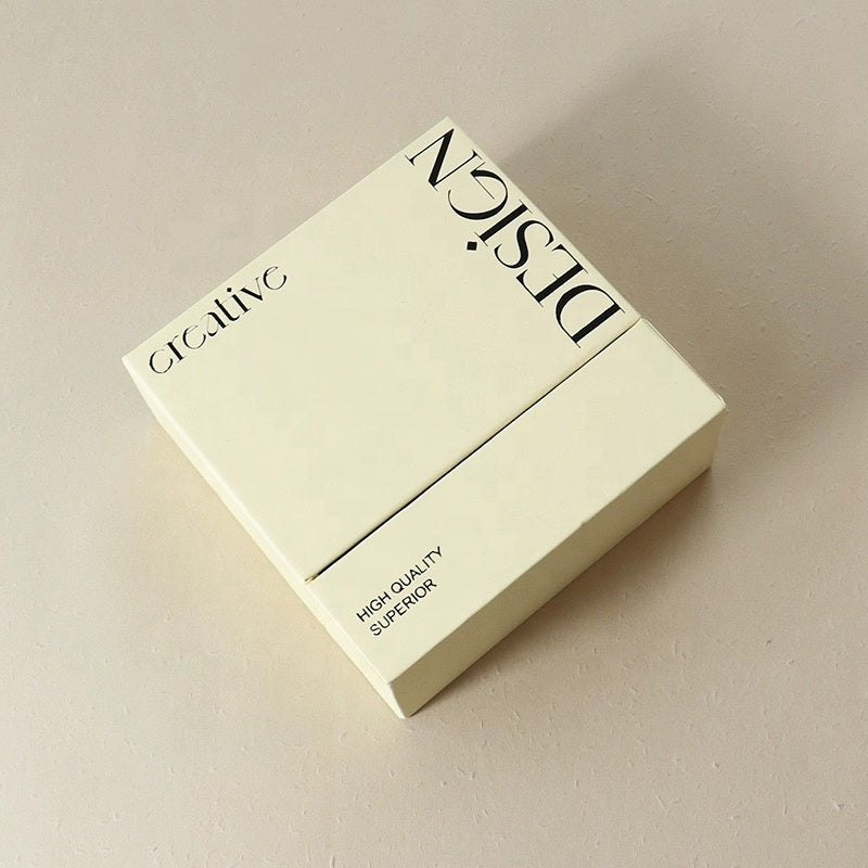 Cream printed tear-apart slide-lid food box with black logo and front panel design