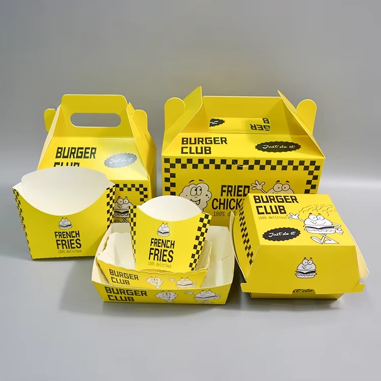 Full set of custom yellow burger club food packaging including gable box, paper boat tray, fry container, and cup