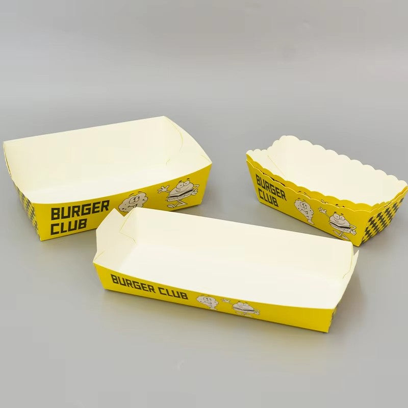 Assorted shapes of empty yellow burger club paper boat trays for fast food serving