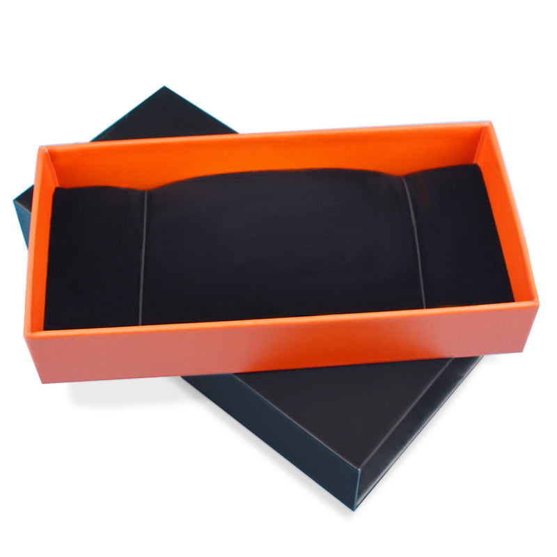 Open rigid drawer box showing contrasting orange inner tray and black base