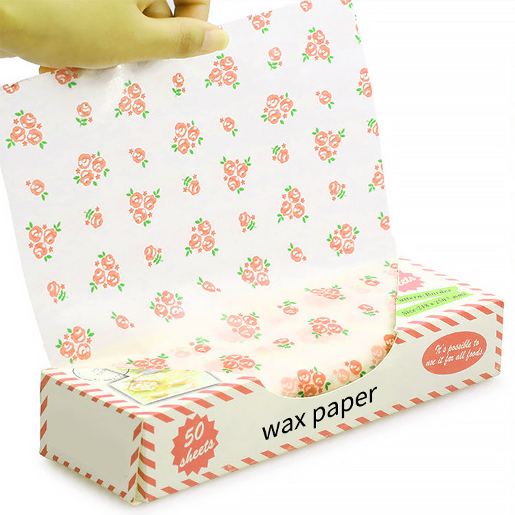 White wax paper with orange floral pattern, folded sheets for food wrapping