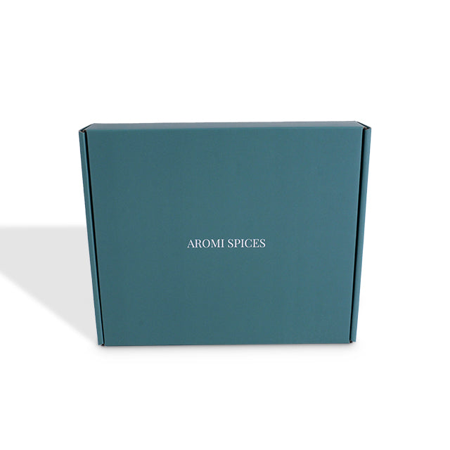 Front view of closed teal cardboard shipping box with custom print area