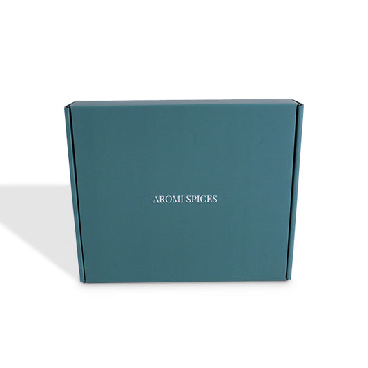 Teal blue mailer box with 'AROMI SPICES' print on front