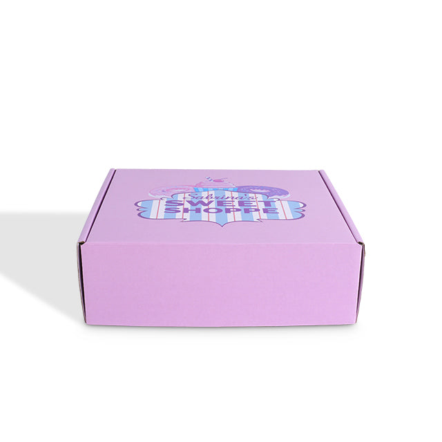 Front view of closed custom purple mailer box with "Sweet Shoppe" donut and cupcake logo