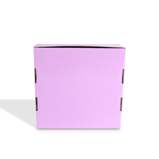 Side view of closed purple mailer box showing locked seams and tuck flaps