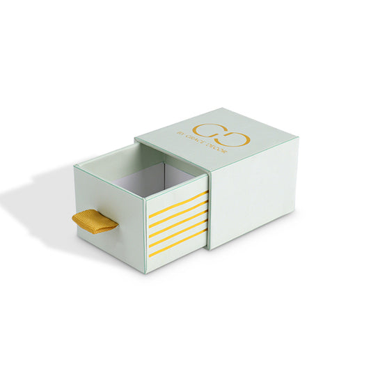Angle view of luxury slide-out gift box with rigid structure and satin ribbon handle
