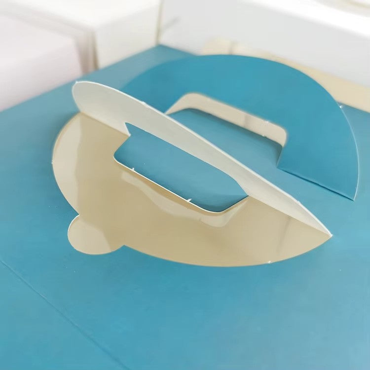 Light blue cake box with cutout handle and white base tray