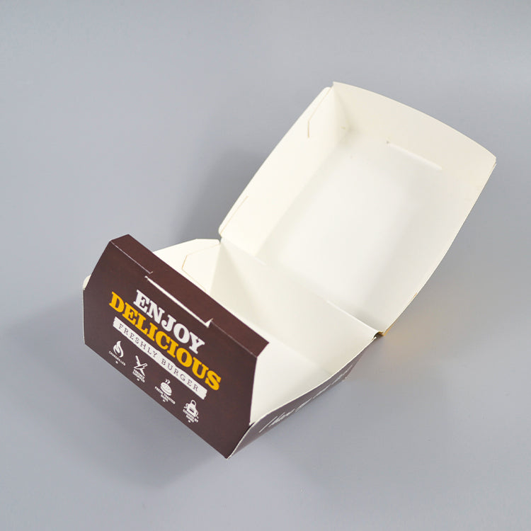Brown burger box with lid open, showing empty white tray interior