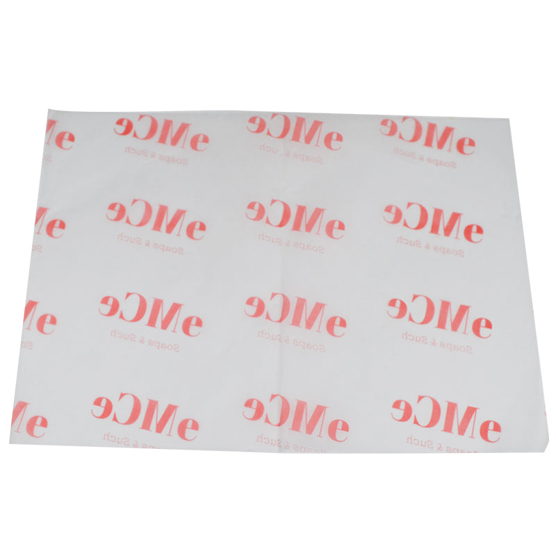 White wrapping paper with orange "eMce" logo arranged in a grid pattern