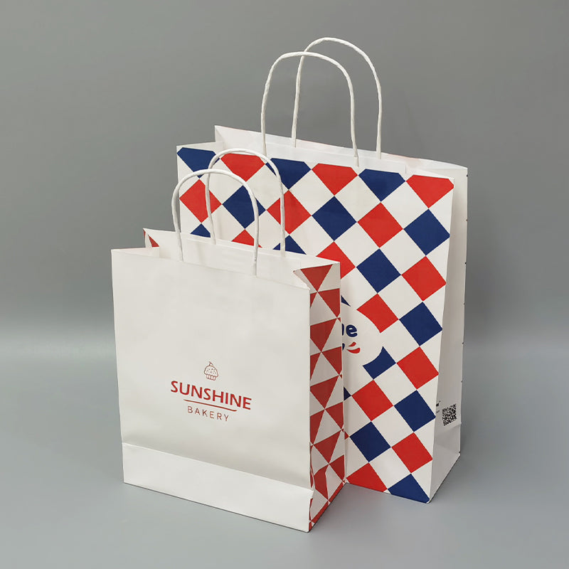 White and red-blue check bakery paper bags with handles, stacked with printed logo